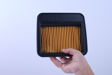 hand hold air filter on white background