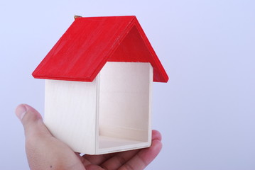 Fototapeta na wymiar hand hold house isolated on white background