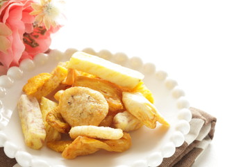Dried and salted fruit and vegetable on dish