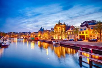 Night View of Harlem Sight on Spaarne River On The Background At twilight