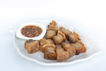 Pork cutlets in a white tray on a white background