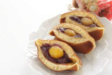 Obraz na płótnie Canvas Japanese confectionery food, chestnut and red bean paste Dorayaki Pan cake sandwiches in half