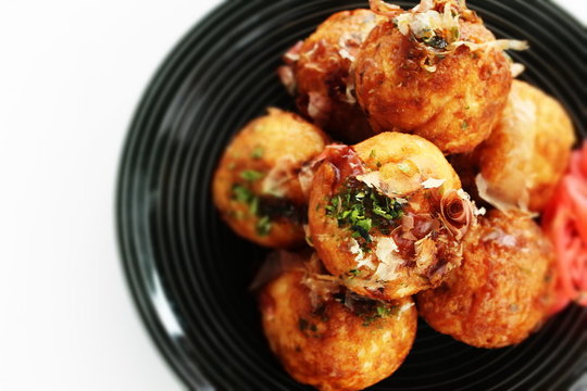 Japanese food, takoyaki octopus ball on dish and sauce