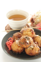Japanese food, takoyaki octopus ball on dish and sauce