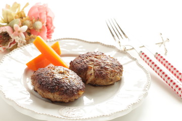 Homemade  hamburger patty and carrot for comfort food