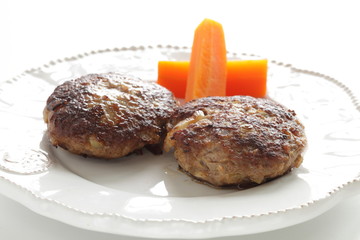 Homemade  hamburger patty and carrot for comfort food