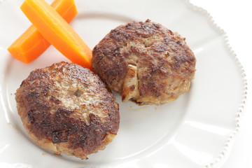 Homemade  hamburger patty and carrot for comfort food