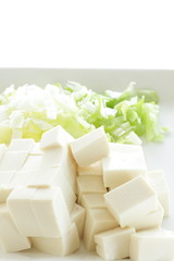 Chinese cooking, tofu and chopped scallion on plate