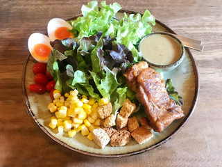 Tasty grilled rib served with organic salad