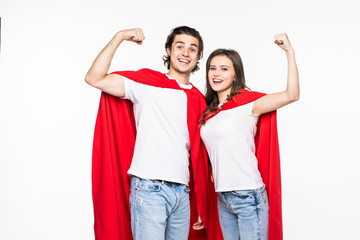 Obraz premium Young couple wear in super hero cout show the power isolated on white background