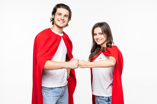 Young couple super hero with fist together isolated on white background