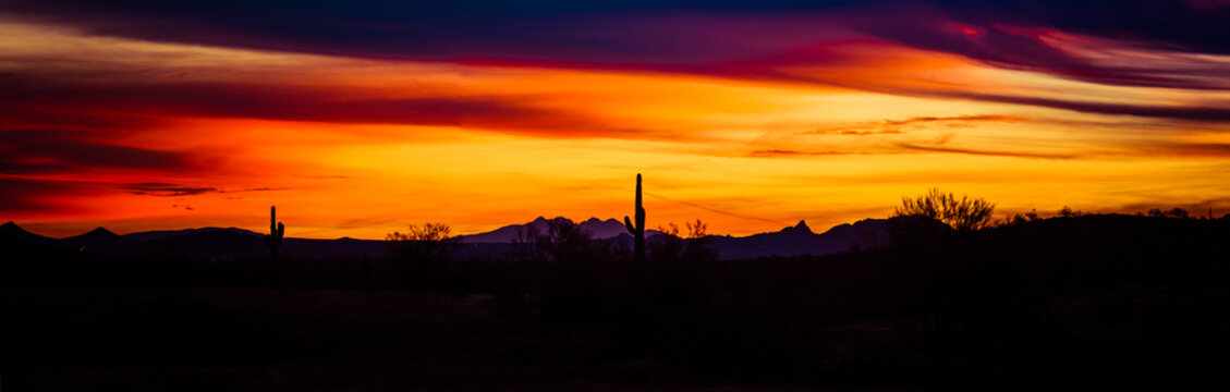 Panoramic image of a sunset over the Sonoran Desert of Arizona.