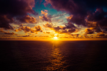 A dramatic sunrise over the Pacific Ocean from the Hawaiian islands.
