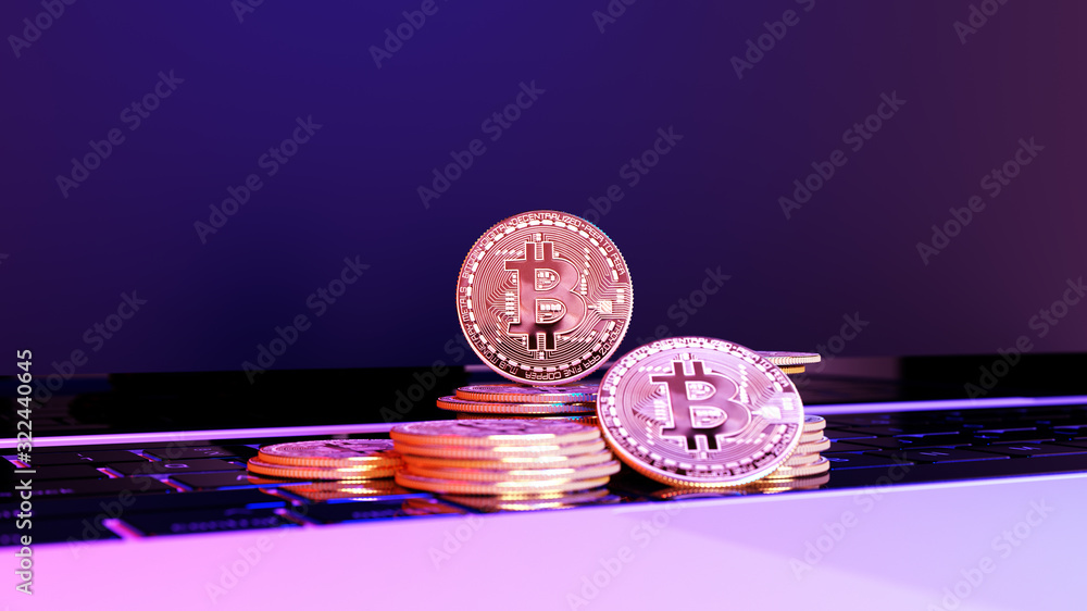 Poster groups of bitcoin with defocused background on the keyboard of laptop. virtual cryptocurrency concep