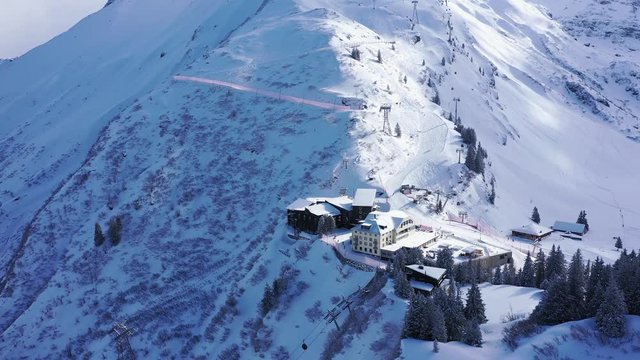 Flight over a snowy mountains in winter - wonderful Swiss Alps - aerial photography