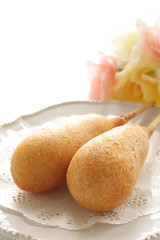 American junk food, corn dog on lace pepper with copy space