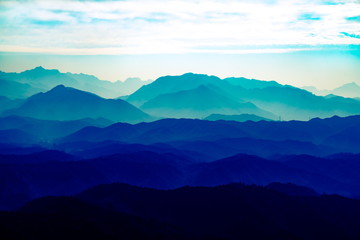 Fototapeta premium Blue dream background of distant mountains. Blue Mountain mobile background. Blue Mountain screen background
