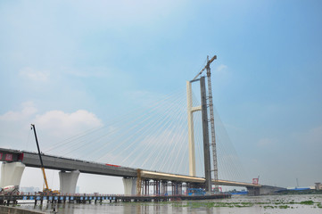 Tanjiang Bridge is an extra-large bridge that is a single pylon cable-stayed double-line railway bridge. The bridge is located in Xinhui, Jiangmen of Guangdong Province that is 5641.07 meters.