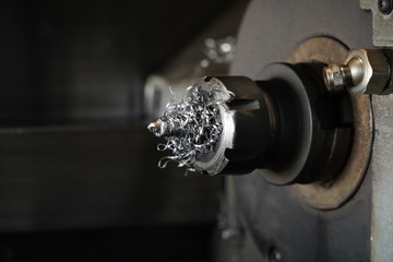 Choose focus, a drill that is full of metal chips from the drill.