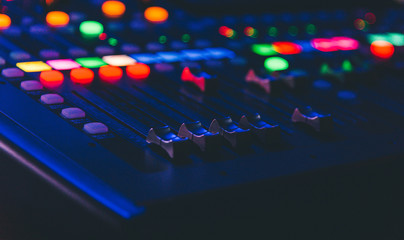 Closeup of an audio mixing control panel