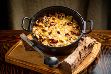 BBQ Side of Melted Mac and Cheese in a Cast Iron Bowl and Plated