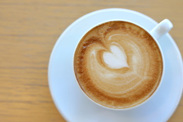 hot latte coffee drink put on wooden table in cafe restaurant