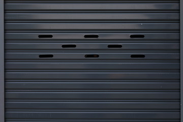 black roller shutter door closed security background