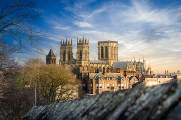 York Minster Cathedral with blue sky sunshine and castle walls