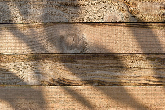 wood barn wall plank texture background with light and shadow in the morning day, top view of old wooden table