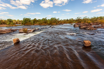 Landscape view of environmental flows from the Ord River Irrigation Scheme flowing over Ivanhoe...