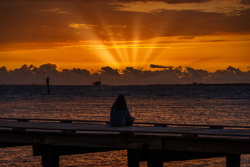 Obraz na płótnie Canvas Sunrise Sitting On Dock