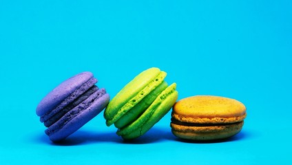 colorful macaroons on blue background