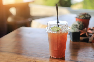iced tea lime in plastic glass for drinking 