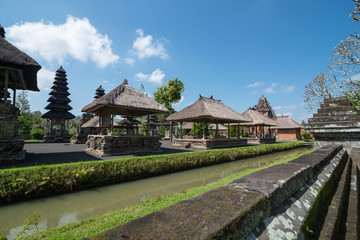 Fototapeta na wymiar The scenery of the Pura Taman Ayun Temple with a clear blue sky in Bali, Indonesia.