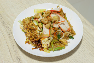 Pad Thai on a plate, put on the table.
