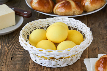 Yellow easter eggs colored with turmeric in a basket