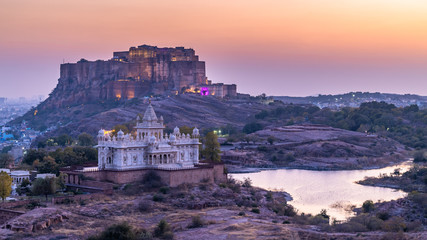 Fototapeta na wymiar The Jaswant Thada and Mehrangarh Fort in background at sunset, The Jaswant Thada is a cenotaph located in Jodhpur, It was used for the cremation of the royal family Marwar, Jodhpur. Rajasthan, India