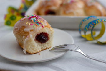 Traditional Polish donuts on wooden background. Tasty doughnuts with jam