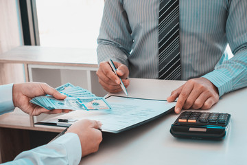 businessman individual who owns the business sign personally sealing the deal with receiving a...