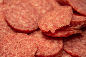 Red italian salami sausage closeup macro photo