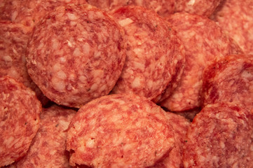 Red italian salami sausage closeup macro photo
