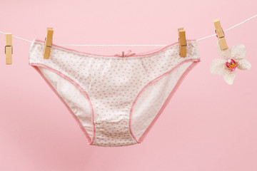 Beautiful women's cotton panties on pink background.