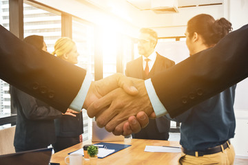 Close up people hands shake business partnership success,Shake hand concept,Business team meeting in office teamwork planing marketing project