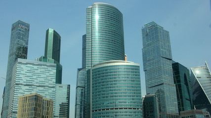 Moscow city tall towers on clear blue sky background, modern business center facade glass