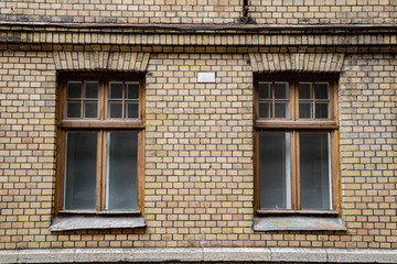 Vintage old brick wall and wooden windows