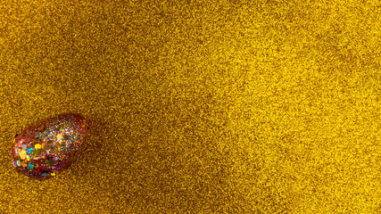 Red golden egg. A symbol of making money and successful investment on festive gold background