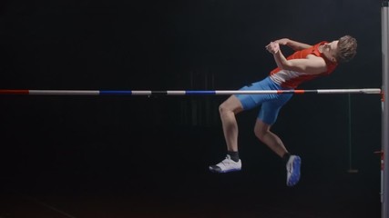 Slow motion: Athlete Doing High Jump success