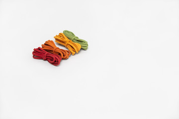 collection of various strings on white background. colorful threads. bundle of chamois string.
