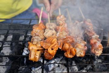 Grilled pork intestine in barbecue sticks sold at a street food stall