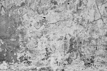 Texture of a concrete wall with cracks and scratches which can be used as a background